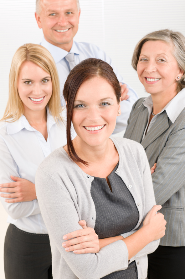 Business team young woman with mature colleagues