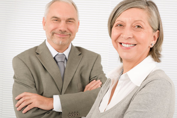 Senior businesspeople smile cross arms portrait