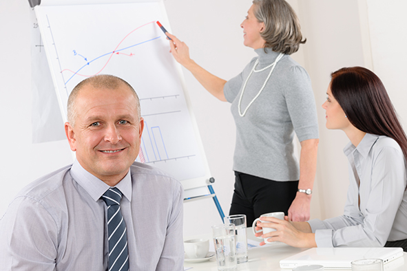 Smiling businessman during team meeting