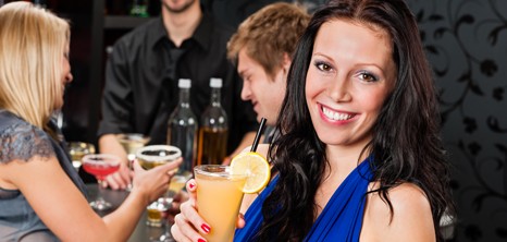 Young people at cocktail bar